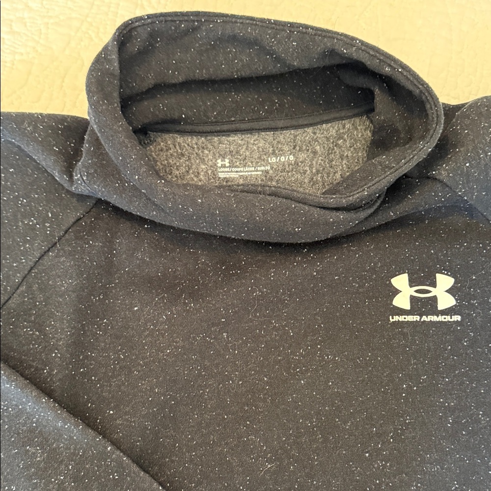Under Armour Woman’s speckled black crop sweatshirt.